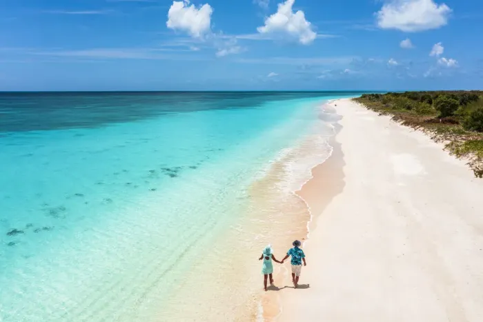 Framed Print : Man and woman walking hand in hand on a beach washed by the turquoise sea, Barbuda, Antigua and Barbuda, West Indies, Caribbean, Central America Framed Print : Man and woman walking hand in hand on a beach washed by the turquoise sea, Barbuda, Antigua and Barbuda, West Indies, Caribbean, Central America