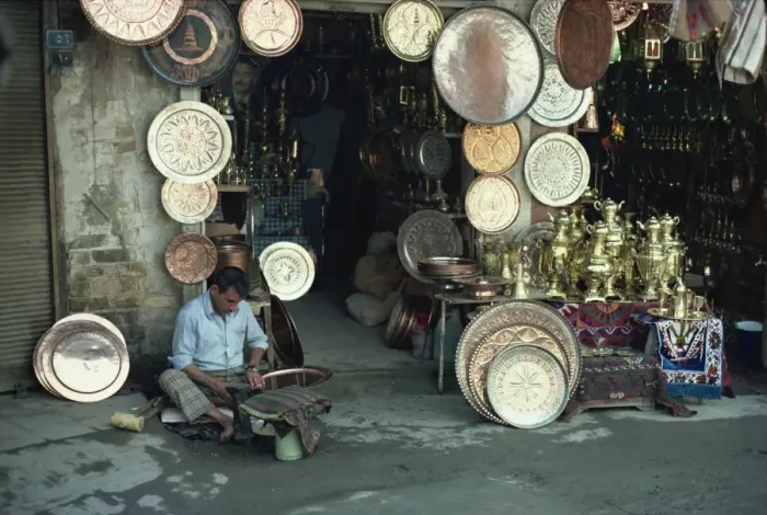 Framed Print : Man working on copper plate outside a copper souk, Baghdad, Iraq, Middle East Framed Print : Man working on copper plate outside a copper souk, Baghdad, Iraq, Middle East