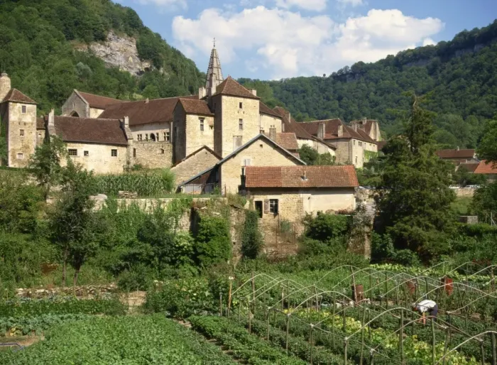 Framed Print : Man working in vegetable gardens below the village of Baume les Messieurs Framed Print : Man working in vegetable gardens below the village of Baume les Messieurs