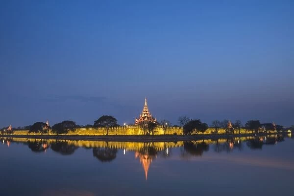 Mandalay City Fort and Palace reflected in the moat surrrounding the compound at night