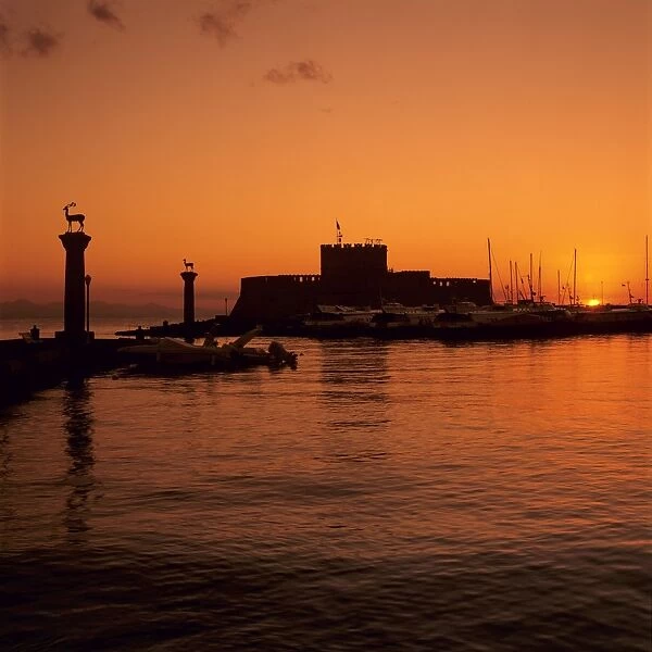 Mandraki Harbour at sunrise, Rhodes Town, Rhodes Island, Dodecanese Islands, Greek Islands