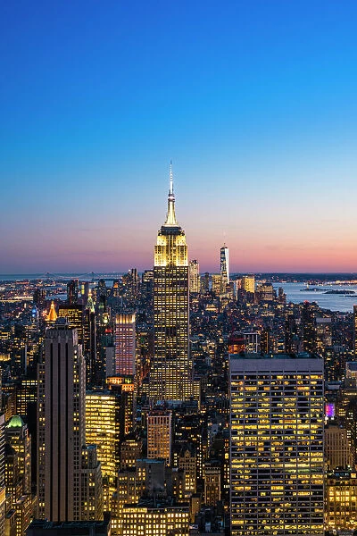 Manhattan skyline and Empire State Building at dusk, New York City, United States of America