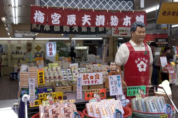 Framed Print : Mannequin of famous Japanese TV personality selling his food products called Tat-chan Zuke at gift shop