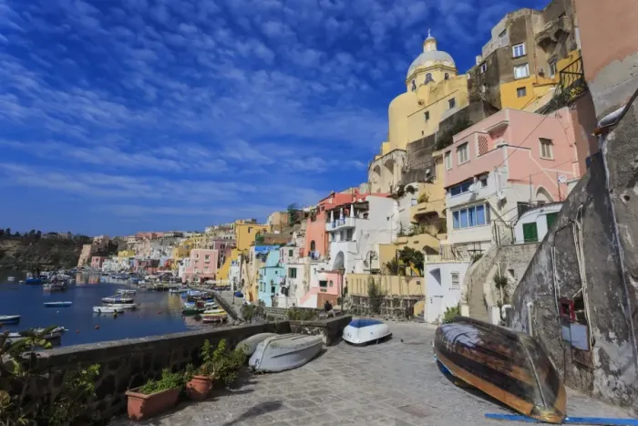 Framed Print : Marina Corricella, pretty fishing village, colourful fishermens houses, boats and church Framed Print : Marina Corricella, pretty fishing village, colourful fishermens houses, boats and church