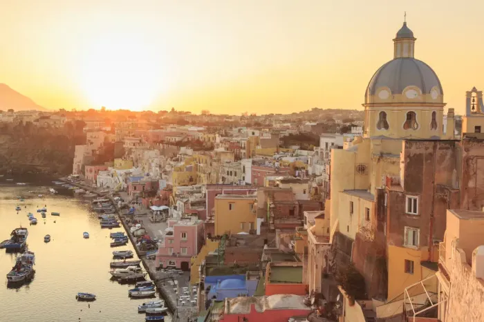 Framed Print : Marina Corricella at sunset, fishing village, colourful fishermens houses, boats and church Framed Print : Marina Corricella at sunset, fishing village, colourful fishermens houses, boats and church