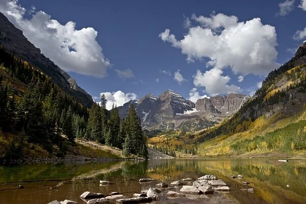 Maroon Bells reflected in Maroon Lake with fall color, White River National Forest