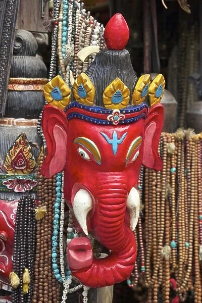 Mask of Ganesha, a Hindu god, on sale at Swayambhunath Stupa (Monkey Temple), Kathmandu, Nepal, Asia