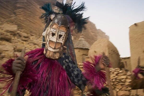 Masked ceremonial Dogon dancer near Sangha, Bandiagara escarpment, Dogon area
