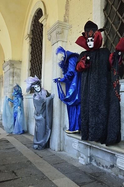 Masked figures in costume at the 2012 Carnival, Venice, Veneto, Italy, Europe