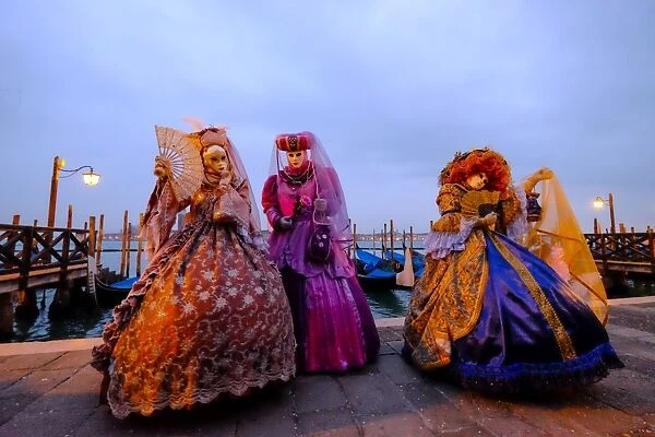 Masks and costumes at St. Marks Square during Venice Carnival, Venice, Veneto, Italy