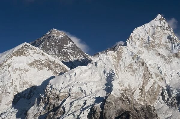 The massive black pyramid summit of Mount Everest seen from Kala Patar with Nuptse