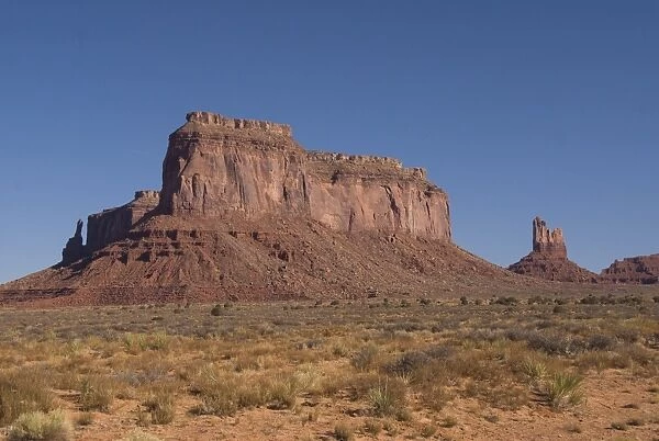 A massive butte adjacent to Monument Valley Navajo Tribal Park, Arizona