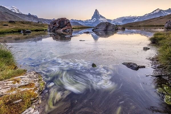 The Matterhorn reflected in Lake Stellisee at dawn, Zermatt, Canton of Valais, Pennine Alps