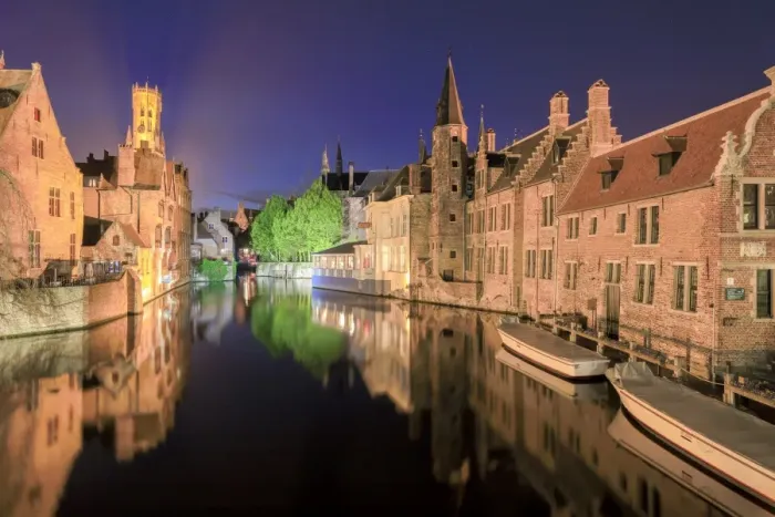 Framed Print : The medieval Belfry and historic buildings are reflected in Rozenhoedkaai canal at night
