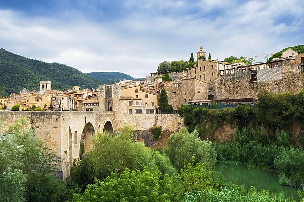 The medieval bridge and fortified old stone city of Besalu in the foothills of the