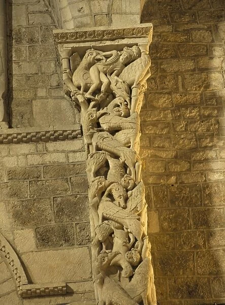 Medieval carving on a pillar within Eglise St. Maur (church of St. Maur)