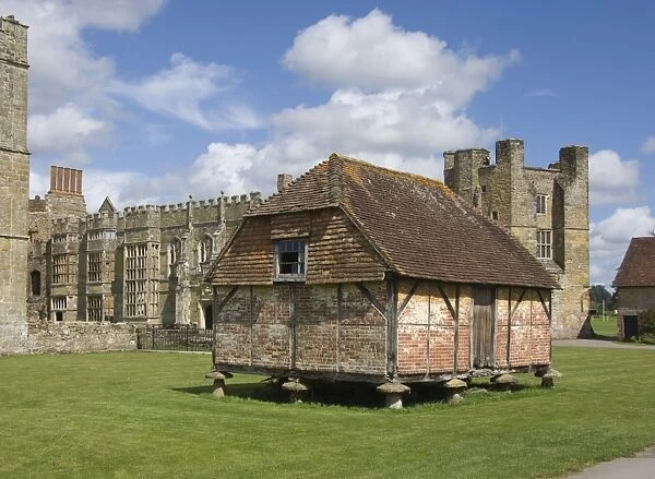 A Medieval granary of oak frame and brick infill, set on toadstools to prevent access by rats, Cowdray Castle, Midhurst, West Sussex, England, United Kingdom, Europe