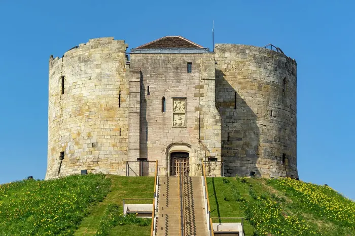 Framed Print : Medieval stone tower on a hill with a clear blue sky in the background, Clifford's Tower, York, North Yorkshire, England, United Kingdom, Europe Framed Print : Medieval stone tower on a hill with a clear blue sky in the background, Clifford's Tower, York, North Yorkshire, England, United Kingdom, Europe