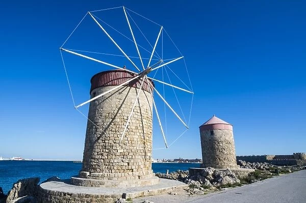 Medieval windmills at Mandraki harbour, City of Rhodes, Rhodes, Dodecanese Islands