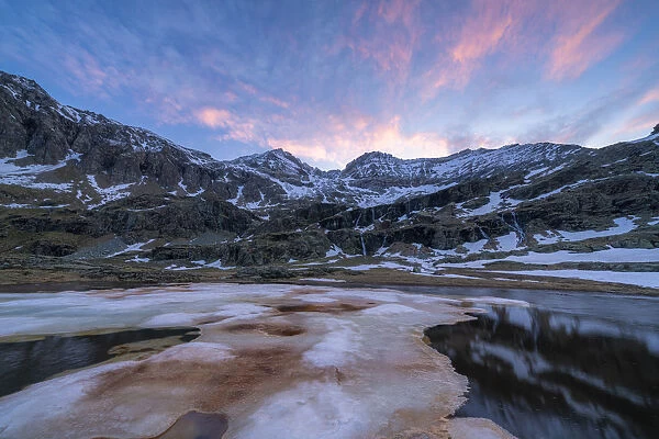 Melting ice during thaw at dawn, Alpe Fora, Valmalenco, Sondrio province, Valtellina