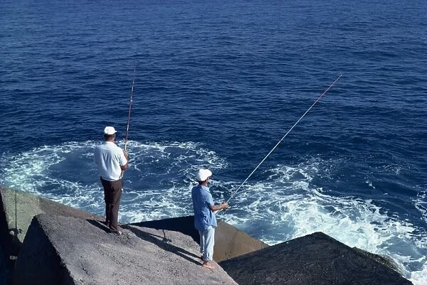 Men fishing off rocks, Tenerife, Canary Islands, Spain, Atlantic Ocean, Europe