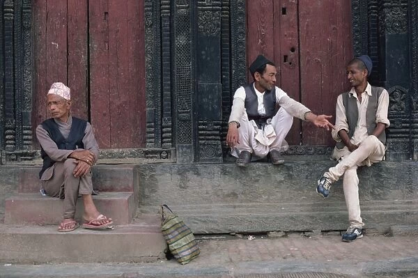 Three men gossiping in Bhaktapur