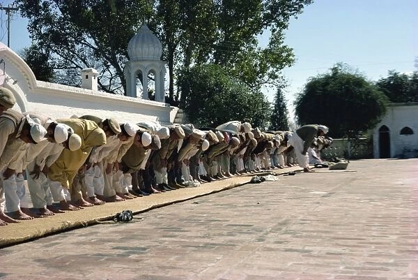 Men praying at mosque