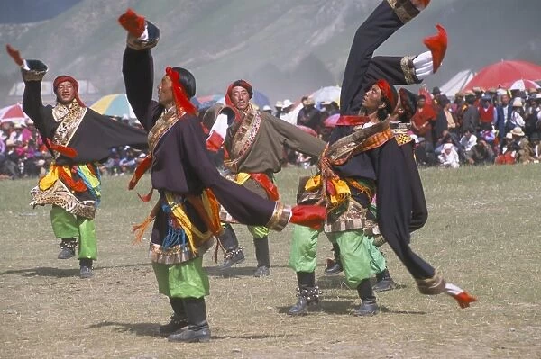 Men in traditional Tibetan dress, Yushu Horse Fetival, Qinghai Province, China, Asia