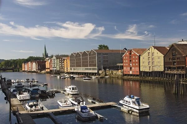Merchants warehouses and boat moorings along the Nidelva, Trondheim, Norway