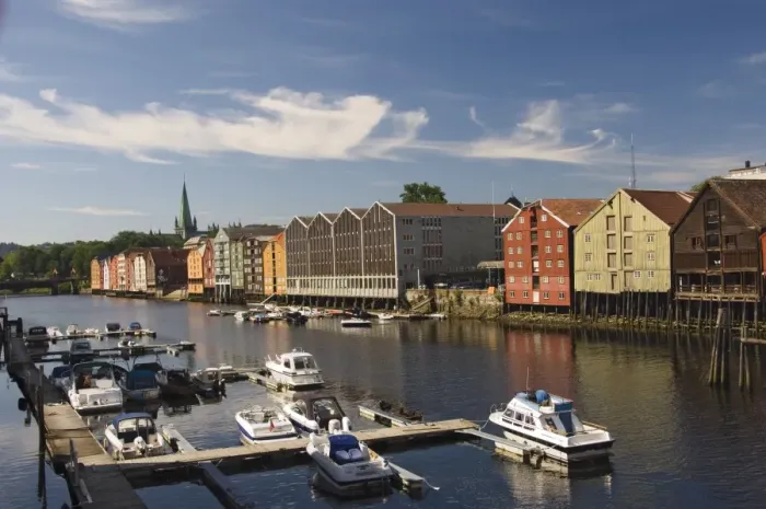 Framed Print : Merchants warehouses and boat moorings along the Nidelva, Trondheim, Norway