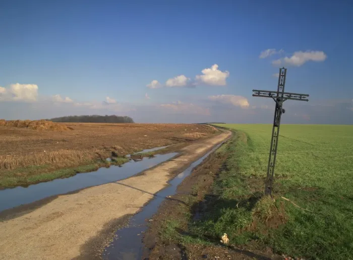 Framed Print : Metal crucifix beside a muddy rural road through agricultural land, near Azincourt Framed Print : Metal crucifix beside a muddy rural road through agricultural land, near Azincourt