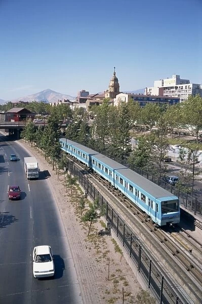 The Metro train alongside a road in Santiago, Chile, South America