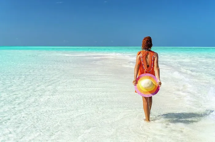 Framed Print : Mid adult woman enjoying walking on a beach, Zanzibar, Tanzania, East Africa, Africa Framed Print : Mid adult woman enjoying walking on a beach, Zanzibar, Tanzania, East Africa, Africa