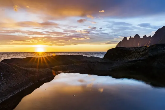 Framed Print : Midnight sun over the fjord and mountain peaks known as Devils Teeth Framed Print : Midnight sun over the fjord and mountain peaks known as Devils Teeth
