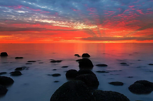 Midsummer sunset over The Wash, from Hunstanton beach, North Norfolk, England, United Kingdom, Europe