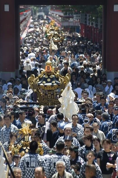 Mikoshi portable shrine of the gods parade and crowds of people