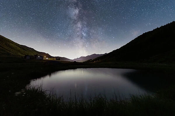 Milky Way over the alpine pond of Pozza Blu, Macolini, Madesimo, Valle Spluga, Valtellina, Lombardy, Italy, Europe