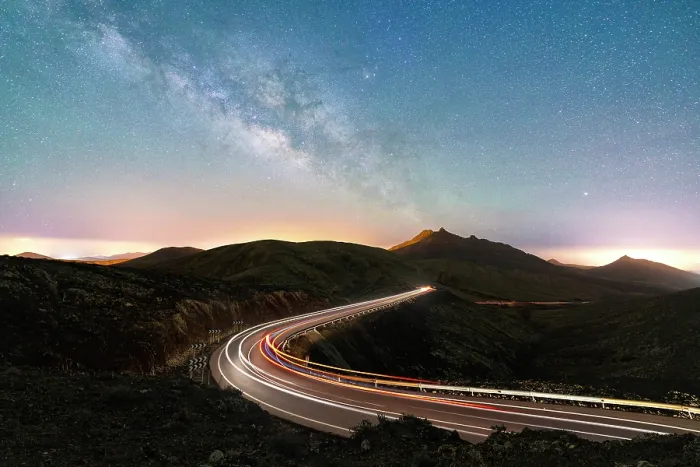 Framed Print : Milky Way glowing over the car trail lights on a winding desert road, Sicasumbre viewpoint, Fuerteventura, Canary Islands, Spain Framed Print : Milky Way glowing over the car trail lights on a winding desert road, Sicasumbre viewpoint, Fuerteventura, Canary Islands, Spain