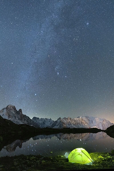 Milky Way glowing over Mont Blanc massif covered with snow