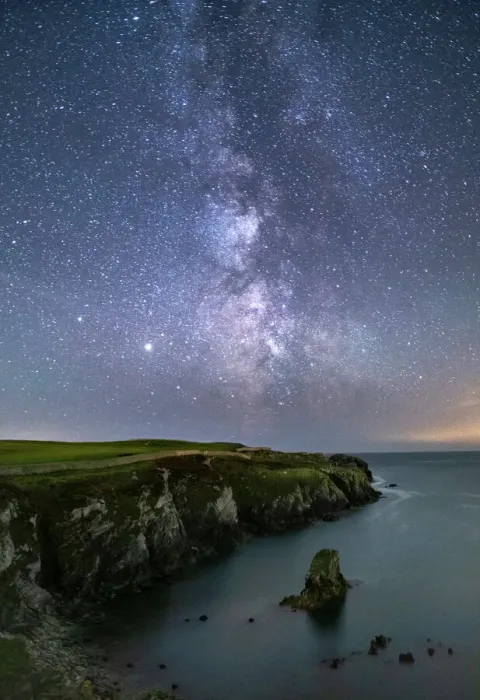 Framed Print : The Milky Way and night sky over Gwenfaens Pillar, Porth Saint, near Rhoscolyn, Anglesey, North Wales, United Kingdom, Europe Framed Print : The Milky Way and night sky over Gwenfaens Pillar, Porth Saint, near Rhoscolyn, Anglesey, North Wales, United Kingdom, Europe