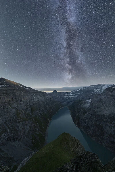 Milky Way in the starry night sky over lake Limmernsee, aerial view, Canton of Glarus