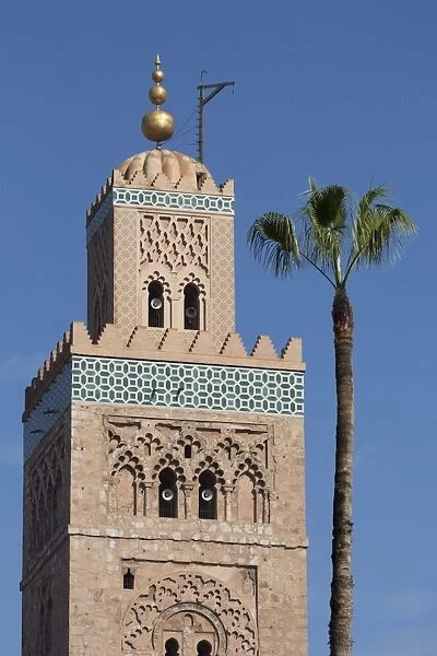 The Minaret of the Koutoubia Mosque with single palm tree, UNESCO World Heritage Site, Marrakech, Morocco, North Africa, Africa