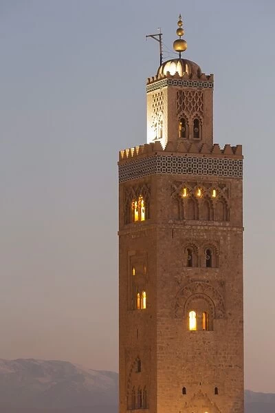 The Minaret of the Koutoubia Mosque, UNESCO World Heritage Site, at dusk with the Atlas mountains beyond, Marrakech, Morocco, North Africa, Africa