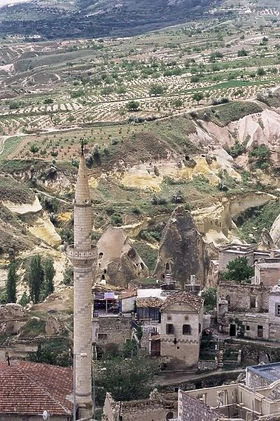 Minaret, volcanic tuff pillars and erosion surrounding Goreme