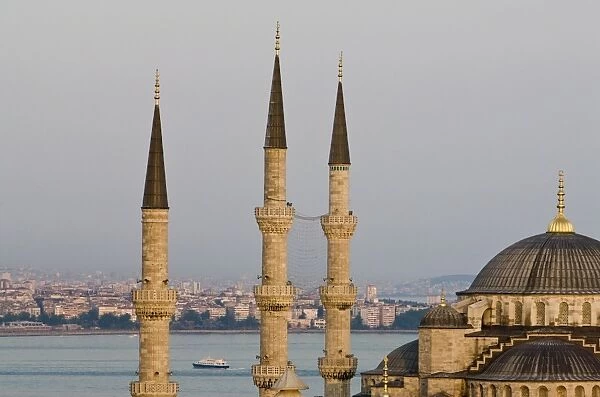 Minarets and dome of Blue Mosque with Bosphorus in background, Istanbul, Turkey, Europe