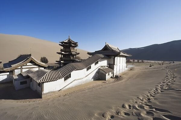 Ming Sha sand dunes and pavilion at Crescent Moon Lake, Dunhuang, Gansu Province