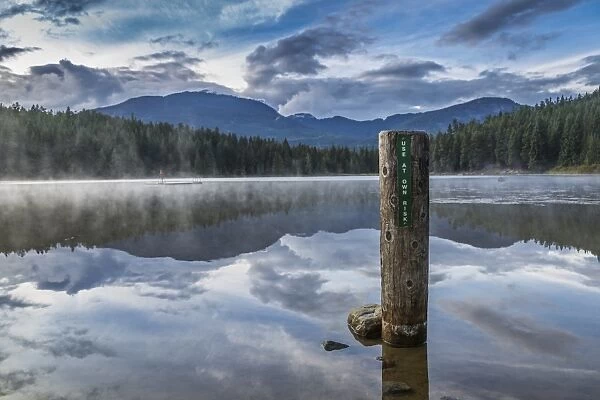Mist on Lost Lake, Ski Hill and surrounding forest, Whistler, British Columbia, Canada