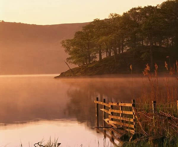 Mist rising on Derwent Water at dawn, Lake District National Park, Cumbria
