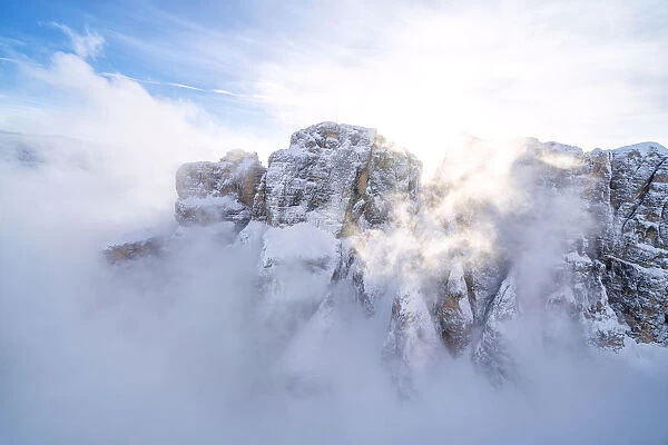 Mist over the snowy peaks of Sella Group, Dolomites, South Tyrol, Italy, Europe