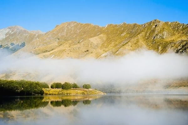 Misty dawn reflections at Lake Moke, Queenstown, Otago, South Island, New Zealand, Pacific